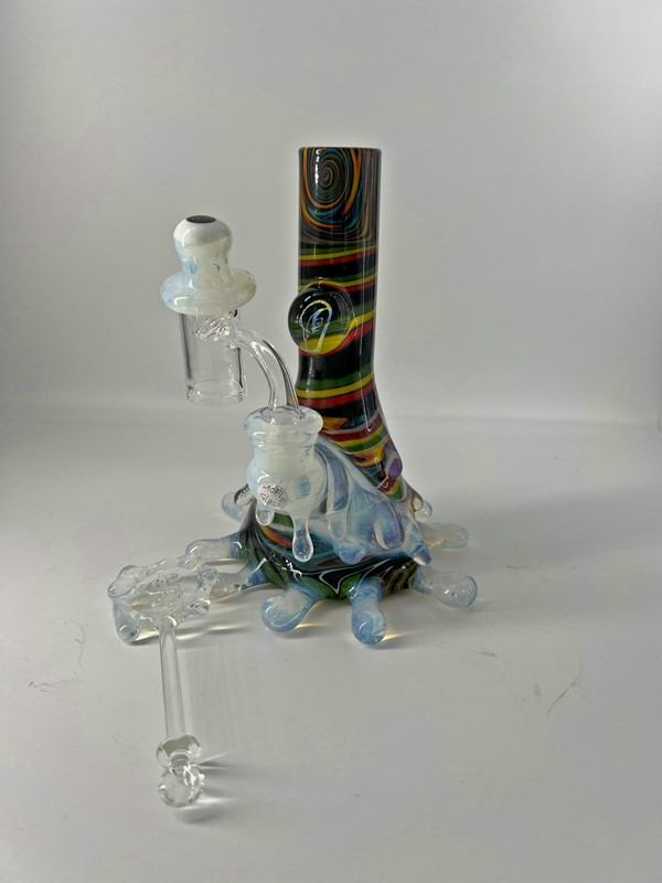 Heady glass bong with rainbow pattern and translucent glass accents