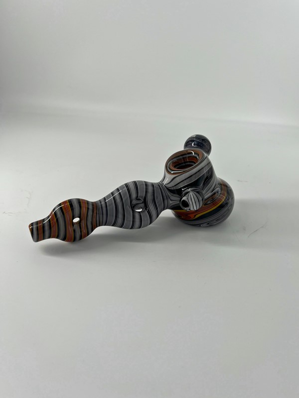 Glass helix pipe with black, orange and white striped design