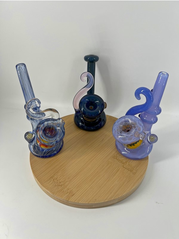 Three miniature heady glass pipes with glass swirl accent